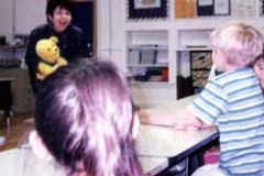 Dr. Radd at the Invitational Education Programs for Carlsbad Schools, working with a group of 1st grade students.