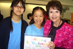 Dr. Radd with students at a school visit in Hong Kong