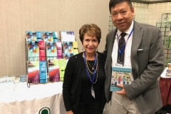 Dr. Radd at her book display within the conference bookstore.