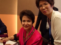Dr. Radd signing books at the International Alliance of Invitational Leadership Conference in Hong Kong, China, in September 2005.